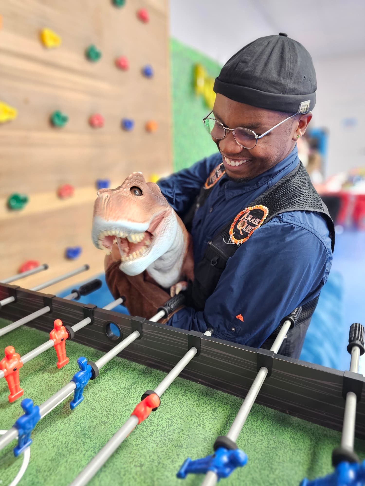 Caregiver and child interacting with puppet