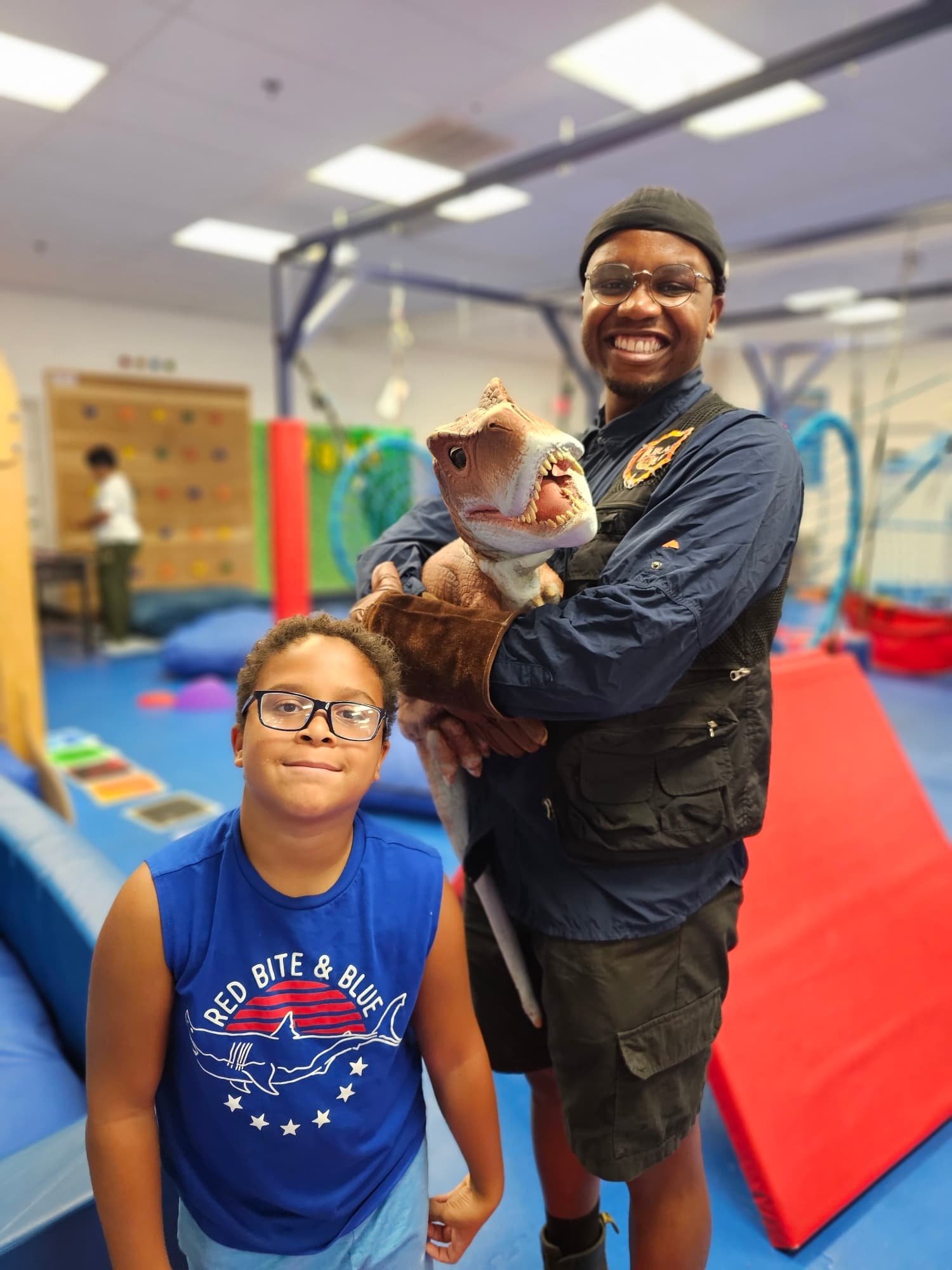 Family enjoying exhibit with support staff